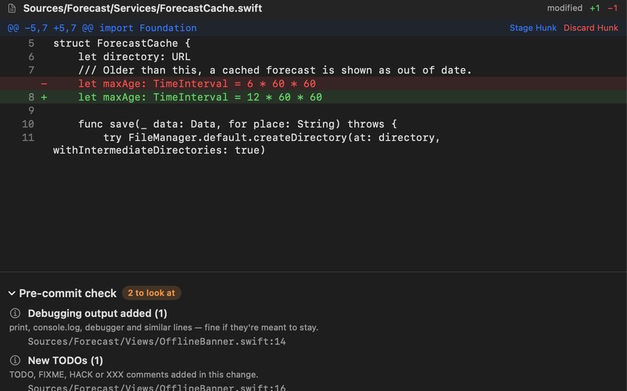 A diff with Stage Hunk and Discard Hunk above a pre-commit check